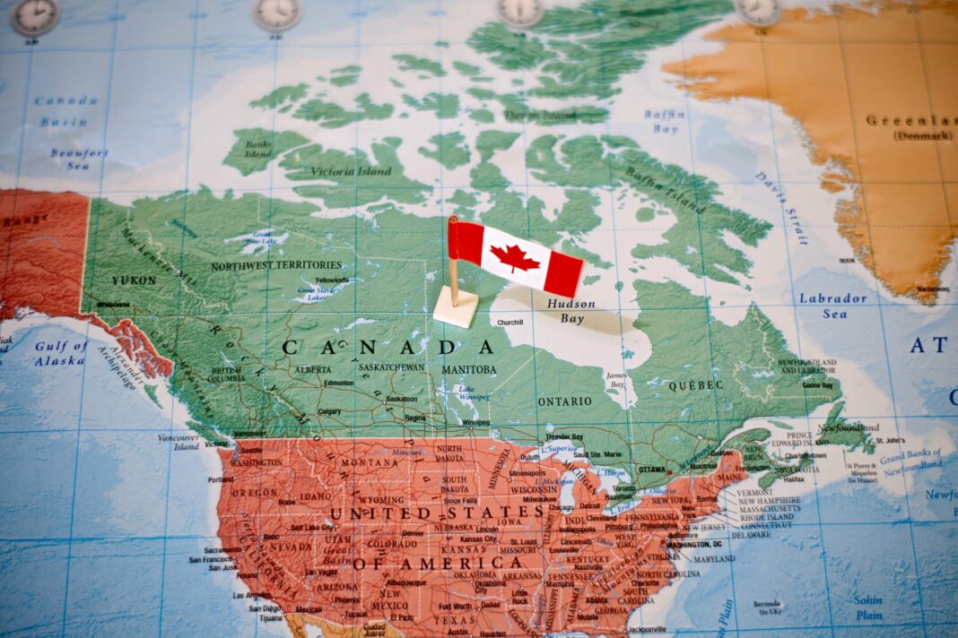 The,Flag,Of,Canada,In,The,World,Map